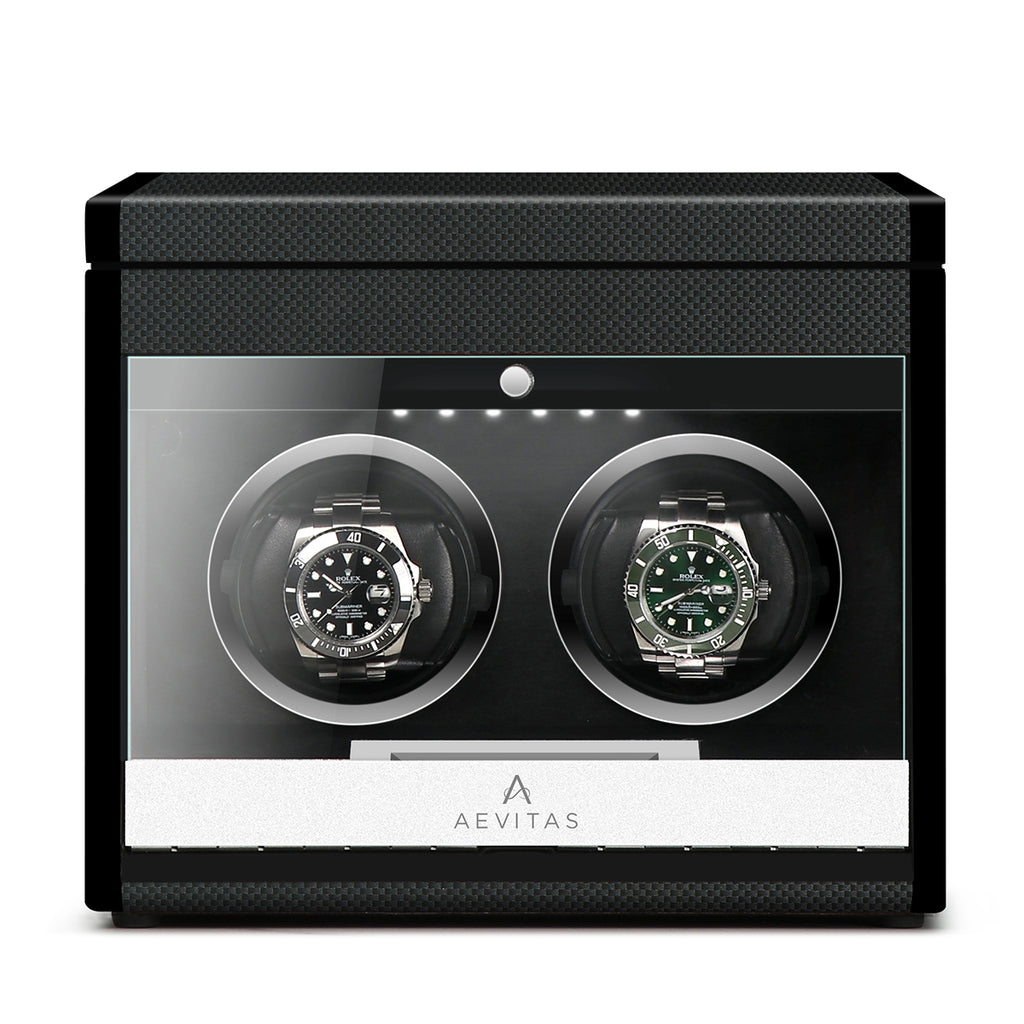 Aevitas 2 watch winder in carbon fibre finish with clear display and two rotating watches.
