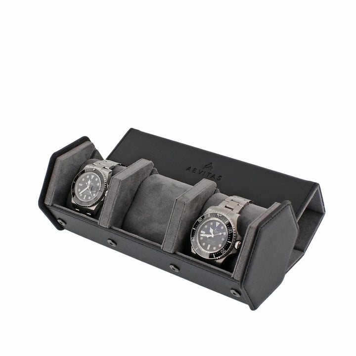 An open Aevitas Watch Winders 3 Watch Travel Case in black leather with grey lining, hexagon style, holds two silver watches with dark dials and space for a third, displayed at an angle on a white background.