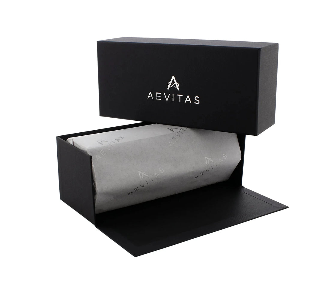 Aevitas Watch Winders' 3 Watch Travel Case in black vegan leather features a sleek hexagon design with grey lining. The lid displays the AEVITAS logo, and the box is shown open to reveal tissue-wrapped contents inside.