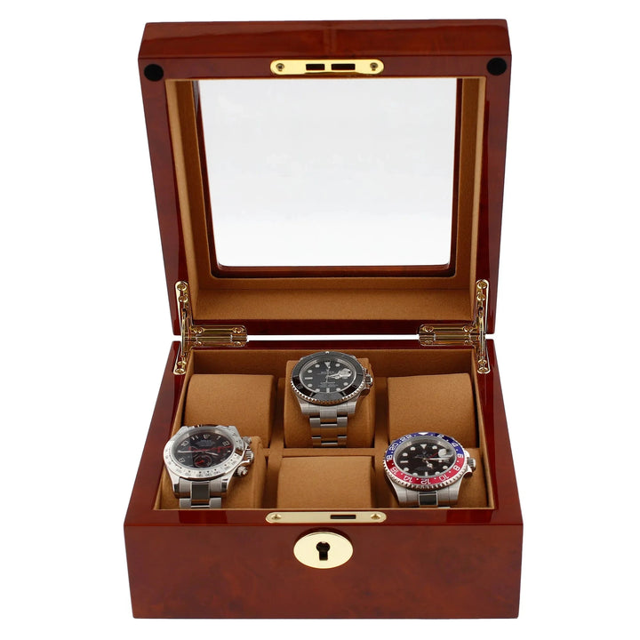 The Aevitas 6 Watch Box, crafted from luxurious camphor wood with a camel lining, features a polished brown finish, gold hinges, glass lid, and keyhole—perfect for displaying your wristwatches in refined style.