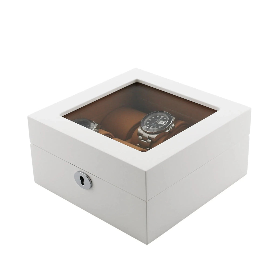 The Aevitas 6 Watch Box in luxurious white wood features a glossy finish, glass top, keyhole front, and a soft camel lining—an elegant way to store and display your wristwatches.