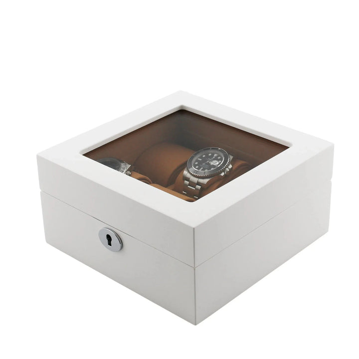 The Aevitas 6 Watch Box in luxurious white wood features a glossy finish, glass top, keyhole front, and a soft camel lining—an elegant way to store and display your wristwatches.