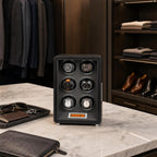 Close-up of 6 watch winder in black vegan leather with grey interior, featuring sleek touchscreen and watches displayed on patented holder in high-end dressing room.