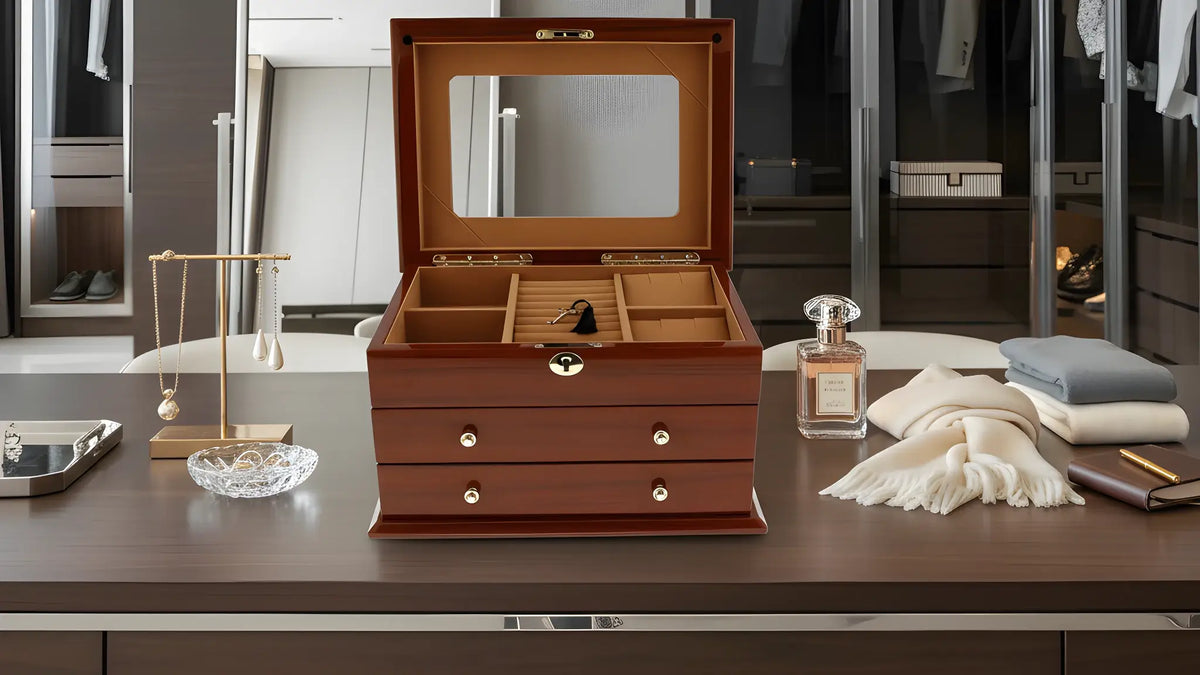 Wooden jewelry box on a dresser with a blurred background