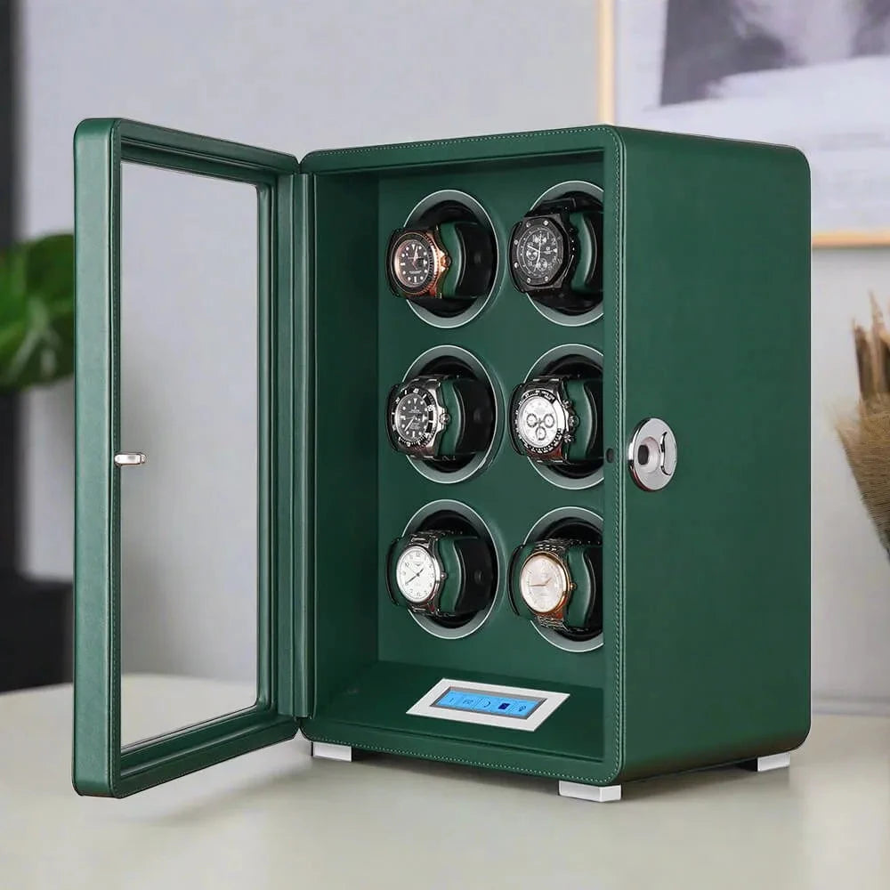 The Automatic 6 Watch Winder Dark Green Smooth Leather Finish by Aevitas displays six wristwatches in rotating slots behind an open glass door, with a digital control panel, elegantly set on a light-colored surface.