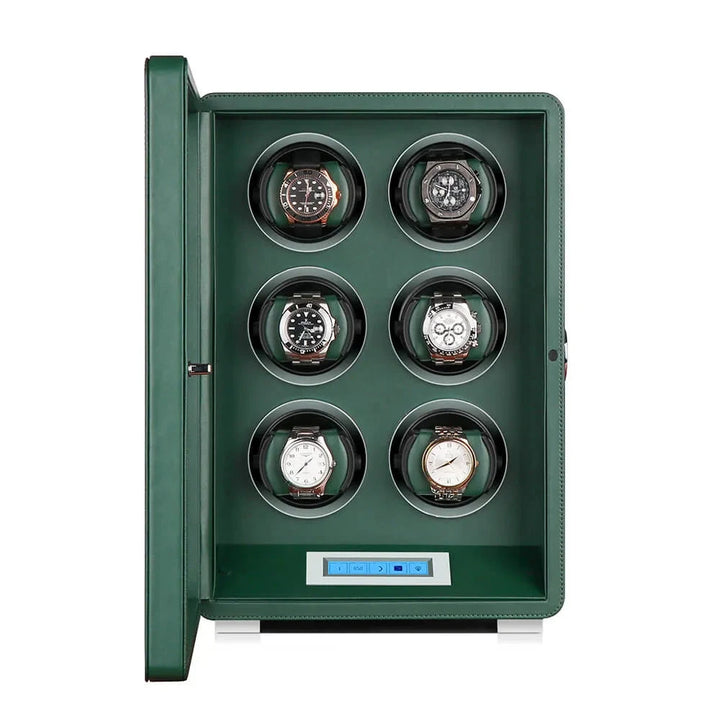 The Aevitas Automatic 6 Watch Winder in dark green smooth leather features a glass lid, six circular watch compartments, and a digital control panel at the bottom center.