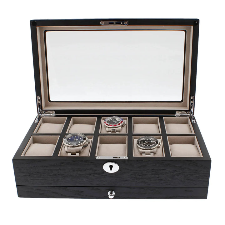 The Aevitas Black Oak Veneer Watch Box holds 10 watches, features a glass lid, keyhole front, extra storage drawer, and plush beige lining—an elegant premium-quality collector's case.