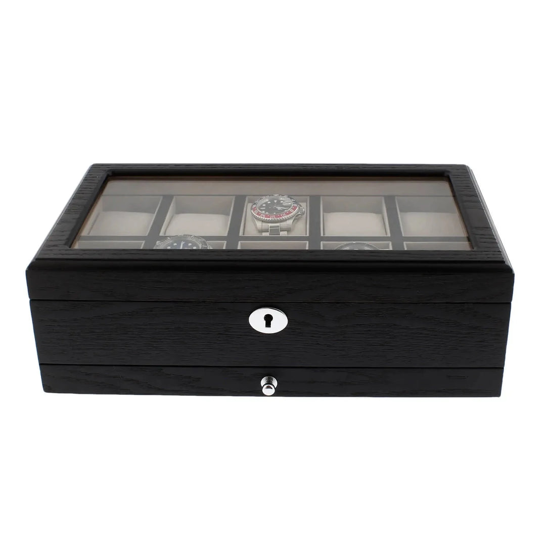 The Aevitas Black Oak Veneer Watch Box for 10 Watches features a glass top, silver keyhole, premium quality build, spacious drawer for extra storage, and elegant display—perfect for collectors seeking style and function.