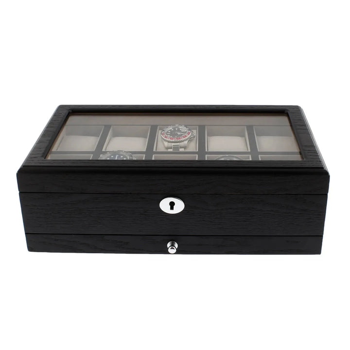 The Aevitas Black Oak Veneer Watch Box for 10 Watches features a glass top, silver keyhole, premium quality build, spacious drawer for extra storage, and elegant display—perfect for collectors seeking style and function.