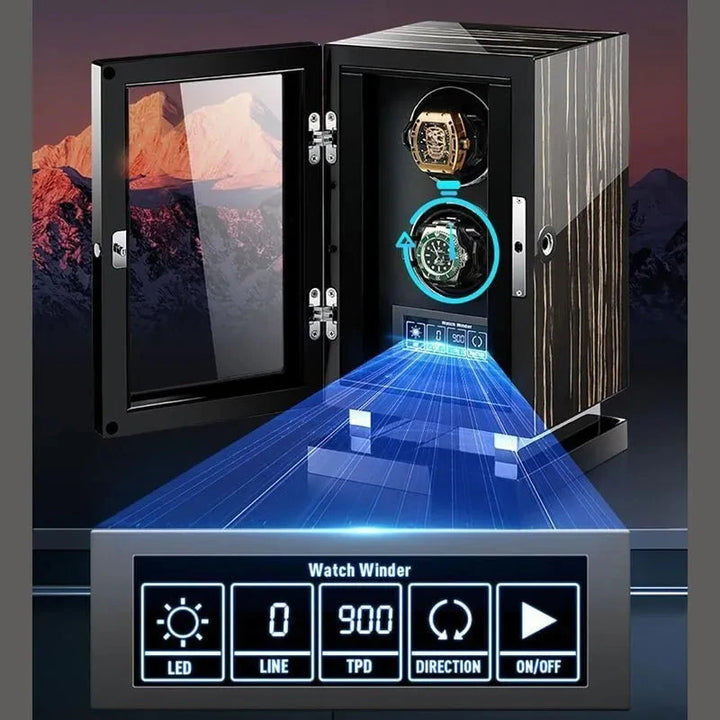 The Aevitas Premium 24 Watch Winder in Striped Ebony Wood Piano Lacquer displays two watches behind an open glass door. A holographic interface projects LED, line, 900 TPD, and direction settings against a mountain backdrop.