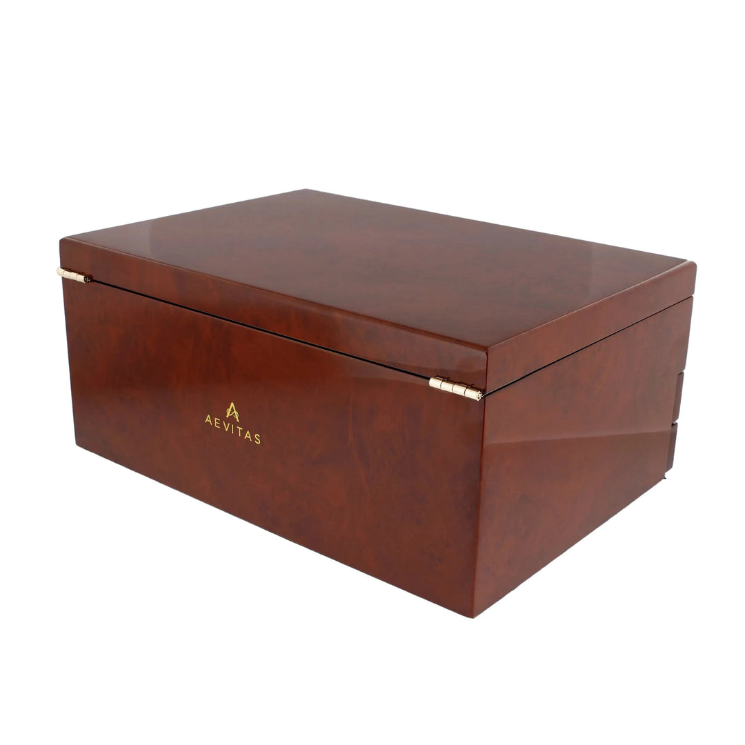 The Aevitas Watch Winders Premium Jewellery Box Extra Large, with camphor finish and camel colour lining, features a sleek rectangular design, glossy brown surface, gold hinges, and the Aevitas logo on the front.