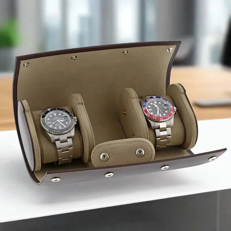 The Aevitas Triple Watch Roll Case, crafted from premium dark brown calf leather, elegantly secures three wristwatches, showcased on a modern table with a stylish blurred office backdrop.