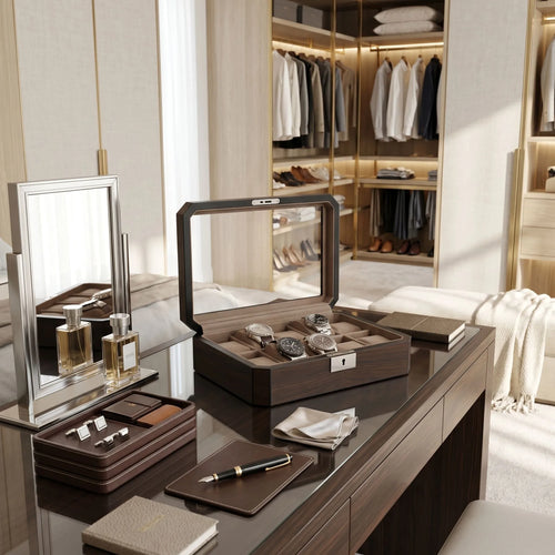 Dark walnut veneer watch box in a walk-in dressing room with elegant props and luxurious modern decor.