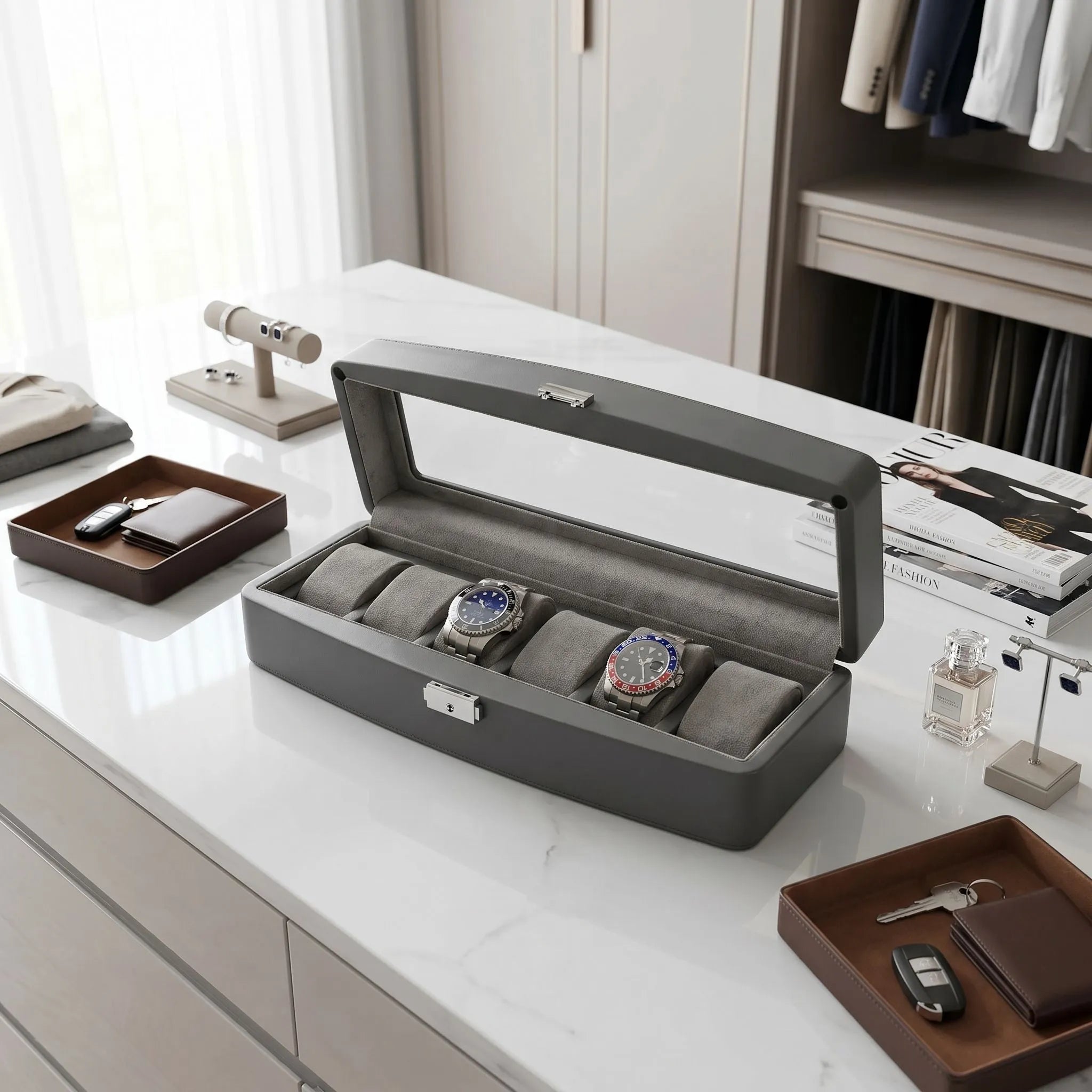 Grey leather 6 watch box with glass lid, lock, and key in a modern dressing room setting, designed for elegant watch storage.